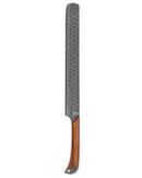 The Folded Steel Lotus BBQ Slicer Brisket Knife features an AUS10 stainless Damascus steel blade, a polished wooden handle, and stylish metal fittings at both ends secured with metal rivets.
