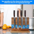 A person stands behind the Norpro Magnetic Knife Block Double-Sided Acacia Wood Knife Holder with Blue Resin and four knives on a kitchen counter next to oranges; text above reads, Declutter your kitchen with stylish, organized storage.