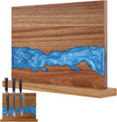 The Norpro Magnetic Knife Block Double-Sided Acacia Wood Knife Holder with Blue Resin holds three knives vertically, featuring front and side views to showcase its stylish blue resin river design and functional storage.