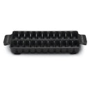 The Napoleon Grills Cast Iron Jumbo Shrimp Tray (67734) features a rectangular black cast iron design with handles and twelve deep compartments, ideal for baking individual portions or grilling shrimp.