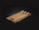 The Napoleon Charcuterie Board (70112) by Napoleon Grills features wood construction, three white ceramic ramekins at one end, and the Napoleon logo, all shown against a black background.