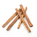 Four pieces of Papa's Grilling Products apa’s Premium Fatwood Firestarter (.1 CU FT) are arranged on a white background, resembling natural firestarter sticks.