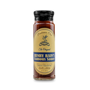 A glass jar of Pendennis Club The Original Henry Bain’s Sauce by Bourbon Barrel Foods has a black lid and yellow label with blue text, describing this all-natural Kentucky sauce as perfect for beef, fowl, and pork.