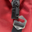 Close-up of the Polar Bear Coolers 12 Pack Original Nylon Soft Cooler in red, featuring a black zipper and a metal buckle with an engraved bear detail on the strap, showcasing its unique style and insulated function.