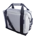 The Polar Bear Coolers 12 Pack Original Nylon Soft Cooler is a light gray rectangular insulated bag with black handles, an adjustable shoulder strap, zippered top, and side logo tag—perfect for outings.