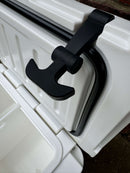 Close-up of a black latch securing the partially open lid of the Polar Bear 20 Hard Cooler by Polar Bear Coolers, showing the rubber seal around the edge for maximum ice retention.
