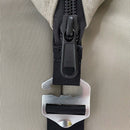 Close-up of a black YKK zipper on beige fabric next to a metal buckle on a black strap—features of the Polar Bear 24 Pack Original Nylon Soft Side Cooler by Polar Bear Coolers, built for dependable ice retention on any adventure.