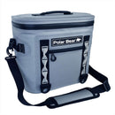 The Polar Bear Topper 30 Floating Soft Cooler by Polar Bear Coolers is gray, waterproof, with a black adjustable shoulder strap, zippered top, front logo, two vertical loops, small zip pocket, and keeps ice for up to 48 hours.