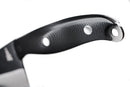 Close-up of the Primrose Cleaver by Folded Steel, featuring a black textured handle with metal rivets and a partially visible 1095 high-carbon steel blade—perfect for outdoor cooking or as a durable camp cleaver. Set against a white background.