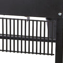 Close-up of a black metal grill grate attached to the Smokin Brothers “36” Premier Plus Pellet Grill, with a screw visible at the top right and a bucket partially seen in the background.
