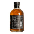 Spice Witch Chili Oil comes in a glass bottle with a black cap, featuring golden-brown savory chili oil. The label highlights ingredients, uses, nutrition facts, "100% Magical. 0% Boring," and "What did you expect, just enjoy it.