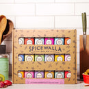 The Spicewalla Kitchen Essentials 18-Pack Collection by Spicewalla features 18 colorful tins, making it the ideal kitchen essentials set, perfect for displaying on your counter alongside utensils and fresh vegetables.