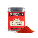 A silver Spicewalla tin of N’Asheville Hot Chicken Seasoning sits beside a mound of vibrant red-orange spice, ready to add bold Southern hot chicken flavor. The tin’s red label features black and white accents.