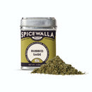 A Spicewalla tin of Rubbed Sage is displayed on a plain white background, with a mound of aromatic, dried sage leaves in front—ideal for seasoning stuffing.