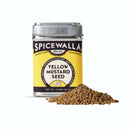 A Spicewalla Yellow Mustard Seed tin sits beside a small pile of yellow mustard seeds—ideal for pickling or homemade mustard—on a white background.