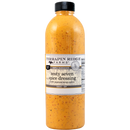 Terrapin Ridge Farms Zesty Seven Spice Dressing is an Asian-inspired dressing with a yellow-orange hue, black specks, a black cap, and a white label displaying Terrapin Ridge Farms branding and product details.