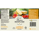 The Texan Heartland Caribbean Pineapple Hot Sauce label showcases ingredients, nutrition facts, and vivid images of pineapple and habanero peppers—ideal for anyone who craves a bold, fruity hot sauce from Texan Heartland.