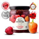 Texan Heartland Cinnamon Raspberry Habanero Hot Jam is displayed with fresh raspberries and habanero peppers, while award badges showcase this Texan Heartland jam’s unique, spicy flavor and prize-winning taste.