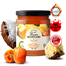 Texan Heartland Coconut Pineapple Habanero Hot Jam is displayed with a cut coconut, habanero pepper, and pineapple slice. Award badges from hot sauce festivals and flavor contests highlight this tropical jam from Texan Heartland.