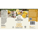 Texan Heartland Lemon, Garlic & Mustard Marinade & Sauce label shows garlic, mustard seeds, lemon slices, and a sauce bowl, with nutrition facts and product details on a beige background.
