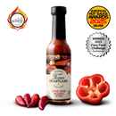 A bottle of Texan Heartland Lone Star Reserve Hot Sauce stands upright among red chili peppers and sliced red bell pepper, with award badges like the 2025 Silver European Hot Sauce Awards displayed in the background.