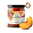 A jar of Texan Heartland Peach Amaretto Pecan Jam sits beside a fresh peach slice. The label, featuring peaches and pecans, displays the Texan Heartland brand and a Scovie Awards logo in the top right corner.