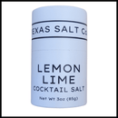 A cylindrical container of Texas Salt Co. Lemon Lime Cocktail Beer Salt, Net Wt 3oz (85g), ideal for rimming margaritas or as beer salt, is shown on a white background.