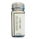 A clear glass jar with a metal lid holds Texas Salt Co. Pure Pacific Table Salt (4.5 oz/128g), perfect for everyday use or as a tasty alternative to standard table salt.