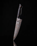 The Folded Steel Hellebore 3-Piece CuMai Knife Set features AUS10 Damascus steel blades and dark marbled handles, elegantly displayed upright against a black background.