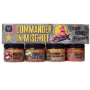 The Spice Guy Commander In Mischief Box includes four grilling spices—Roasted Garlic, Summit Steak & Veg, Colorado Chicken & Veg, and Sweet Heat—in a pin-up art box marked “Flavor Bombs? Fully Detonated.” The perfect BBQ gift set!.