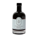 A 12.7 fl oz (375 ml) glass bottle of Under The Bark Syrup Co Blueberry Maple Syrup; this Minnesota-made syrup has a light blue label with black text and a leaf logo.