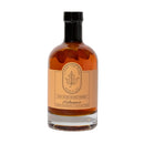 A glass bottle of Under The Bark Syrup Co Habanero Maple Syrup, labeled 100% Pure Maple Syrup with a beige leaf-logo label and black cap, blends sweet maple with spicy habanero for perfect sweet heat.