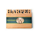 The Words With Boards Personalized Cutting Board Small 9.5" x 12.5" features HARPER carved on top and comes wrapped in a branded green band—a custom kitchen gift made with care by Words with Boards, LLC in Baltimore, Maryland.