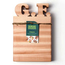 The Words With Boards Gluten Free Personalized Cutting Board (6 1/4" x 9 1/2") by Words with Boards, LLC features large wooden G.F. letters tied with twine and a green tag—ideal for any celiac-safe or gluten free kitchen.