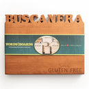 The Words With Boards Seriously Gluten Free Personalized Cutting Board (9.5" x 12.5") features BUSCANERA carved at the top, “Seriously GLUTEN FREE” engraved at the bottom right, and a green “WORDS with BOARDS” label with images of other cutting boards.