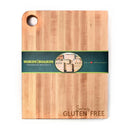 The Words With Boards Seriously Gluten Free Cutting Board (Large, 16” x 12.5”) by Words with Boards, LLC is a rectangular hardwood board with a hole in the top left corner and “Seriously GLUTEN FREE” engraved for easy food separation.