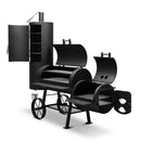 The Yoder Smokers Durango 20 Offset Smoker from Yoder Smokers features a main grill, vertical smoking chamber with shelves, side firebox, sturdy metal wheels, and a mesh lower shelf for large-capacity barbecue cooking.
