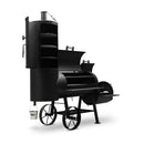 The Yoder Smokers Durango 20 Offset Smoker features a large-capacity horizontal barrel, vertical smoking chamber, side firebox, cooking grates, large wheels, and a hanging white bucket—crafted by Yoder Smokers.