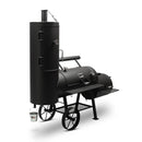 The Yoder Smokers Durango 20 Offset Smoker by Yoder Smokers features a large black body, vertical smoking chamber, two big wheels, handle, side shelf, and drip bucket—ideal for high-capacity BBQs—displayed on a plain white background.