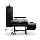 The Yoder Smokers Durango 20 Offset Smoker by Yoder Smokers features a black offset barrel design with a vertical smoking chamber, side firebox, and large metal wheels, delivering high-capacity BBQ performance against a white background.