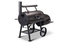 The Yoder Smokers Loaded Wichita Offset Smoker, by Yoder Smokers, features a chimney, temperature gauge, side firebox, metal shelves, and two large wheels for mobility—all shown against a white background.