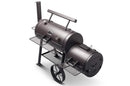 The Yoder Smokers Loaded Wichita Offset Smoker, made in the USA by Yoder Smokers, is a black metal grill with a chimney, temperature gauges, large wheels, and side metal shelves, shown on a white background.