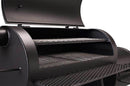 A close-up of the Yoder Smokers Loaded Wichita Offset Smoker by Yoder Smokers, featuring two interior cooking grates and a metal mesh side shelf.