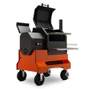 The Yoder Smokers YS480S Competition Pellet Grill with Stainless Steel Shelves features four wheels, a side hopper, front shelves, and dual open lids—ideal for barbecuing, smoking food, or direct-flame grilling.