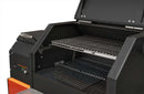 A close-up of the Yoder Smokers YS480S Competition Pellet Grill with Stainless Steel Shelves shows two metal cooking racks, a side control panel, and an orange accent in the lower left—ideal for direct-flame grilling.