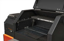 A close-up of the Yoder Smokers YS480S Competition Pellet Grill with Stainless Steel Shelves highlights its spacious dual racks, sturdy lid, side control panel, and direct-flame grilling—all in classic black and orange by Yoder Smokers.
