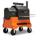 The Yoder Smokers YS480S Competition Pellet Grill features a black and orange design, sturdy wheels, stainless steel shelves, digital control panel, side handle, chimney, and sits on an orange base with the Yoder Smokers logo—ideal for direct-flame grilling.