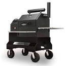 The Yoder Smokers YS480S Competition Pellet Grill with Stainless Steel Shelves features four large wheels, front handles, control knobs, a vented chimney, and visible branding—designed for direct-flame grilling.
