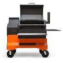 The Yoder Smokers YS640S Competition Pellet Grill with Wire Shelves features a digital control panel, side shelf, sturdy wheels, and a chimney—delivering authentic wood-fired flavor just like a pro-grade pellet grill.