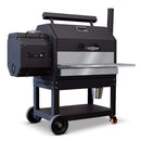 The Yoder Smokers YS640 outdoor pellet grill and smoker features a stainless steel grease shield by Yoder Smokers, with storage, metal shelf, two large wheels, and an orange caster wheel, shown against a white background.